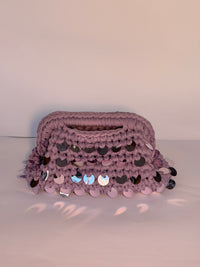 Dusty lilac crochet clutch covered in iridescent paillettes with an integrated top handle