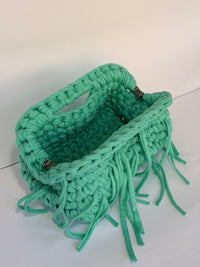 Plaited top handle and chunky stitch on the Mojito mint green crochet clutch