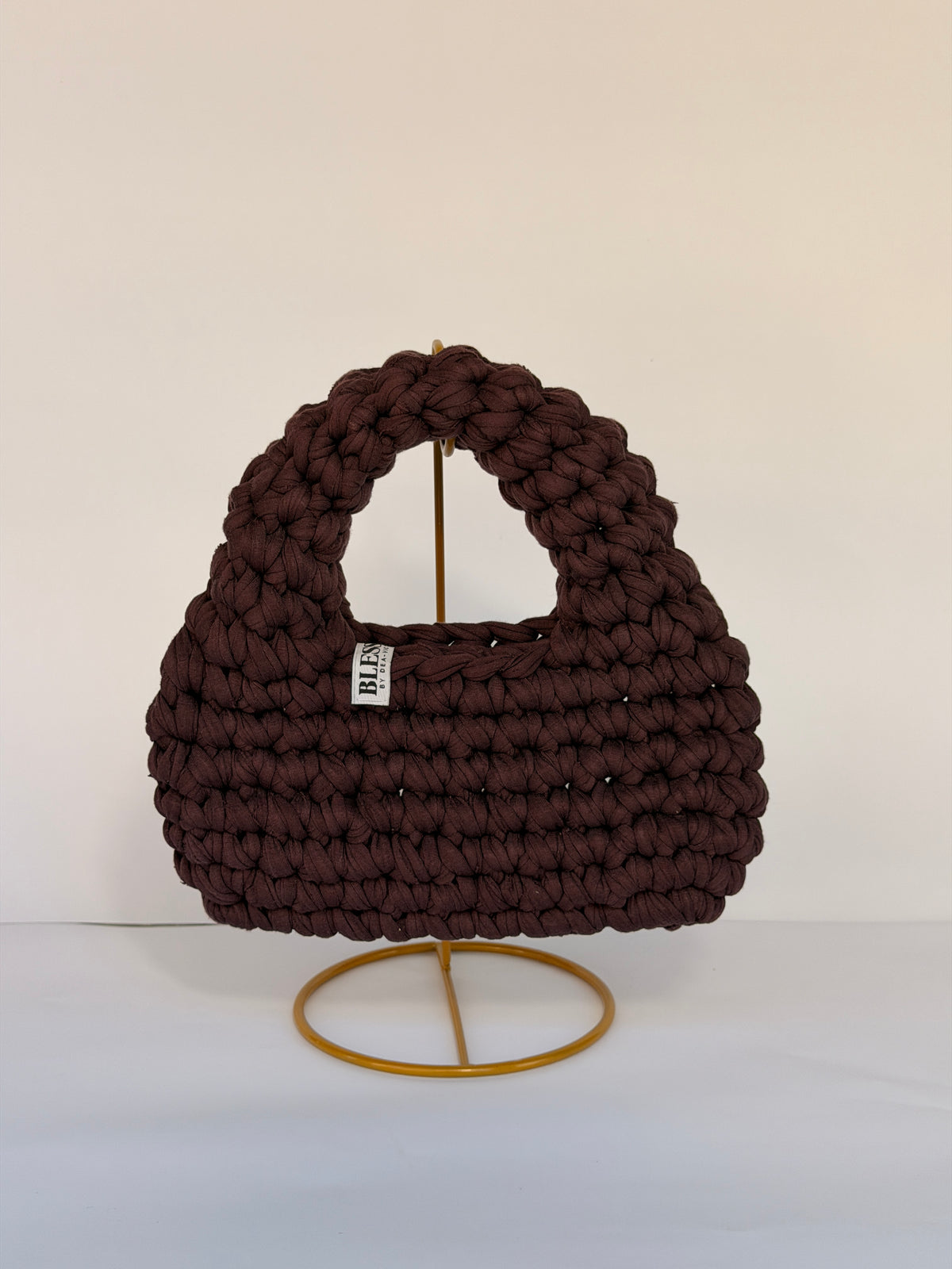 Deep plum-brown crochet bag with a rounded top handle