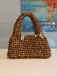 Handmade crochet Suki purse in antique gold metallic yarn with a crystal bee pin