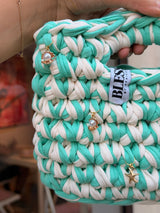 Seaglass green and cream striped crochet bag with a braided top handle and gold shell charms