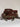 Open top of a warm brown crochet clutch with leopard print ties around the base