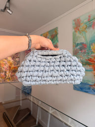 Pale grey crochet clutch worked in a deep bubble stitch