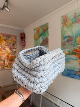 Pale grey crochet clutch worked in a deep bubble stitch