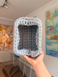 Pale grey crochet clutch worked in a deep bubble stitch