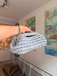 Pale grey crochet clutch worked in a deep bubble stitch