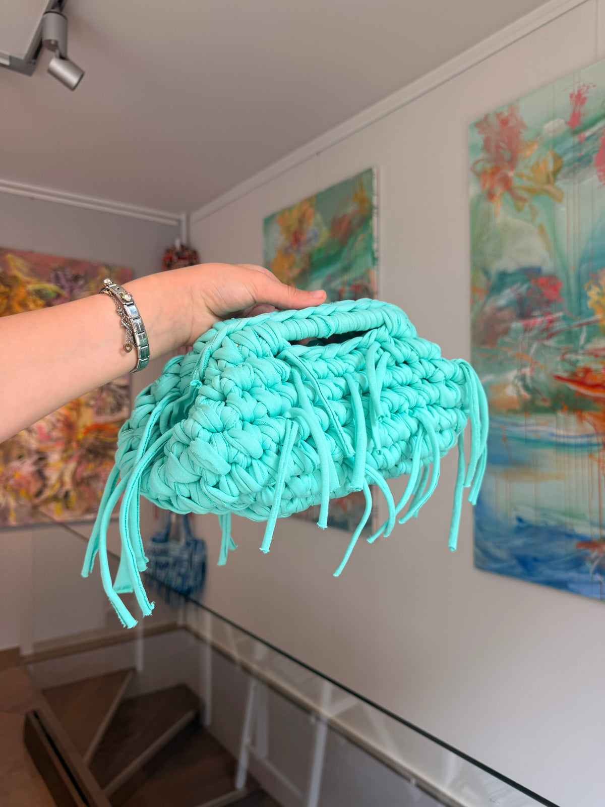 Turquoise crochet clutch with a long fringe