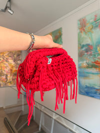 Bright red crochet clutch with a long fringe