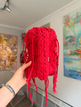 Bright red crochet clutch with a long fringe