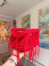 Bright red crochet clutch with a long fringe