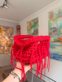 Bright red crochet clutch with a long fringe