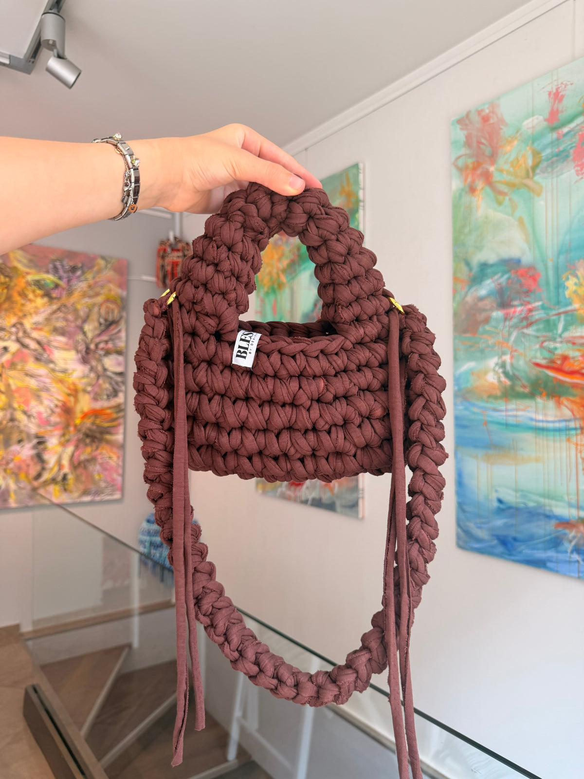 Deep brown crochet shoulder bag with a hand-braided strap