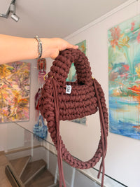 Deep brown crochet shoulder bag with a hand-braided strap