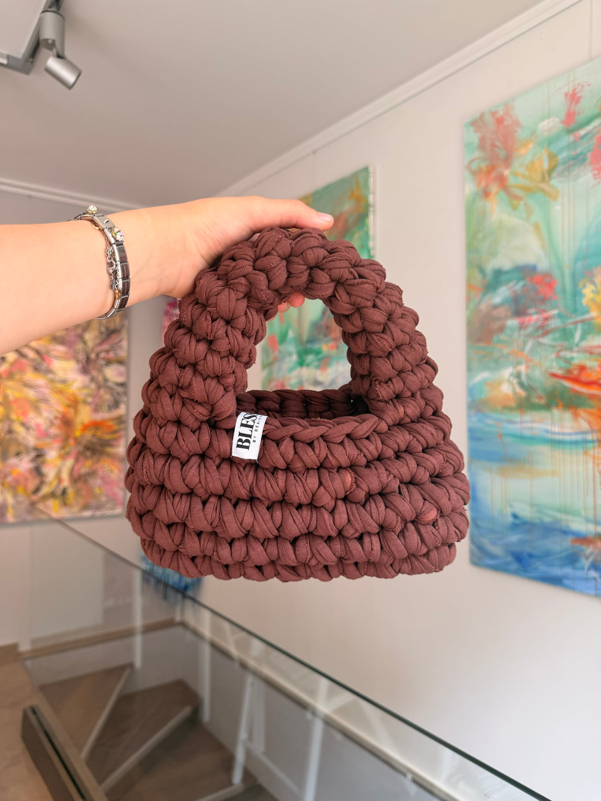Deep brown crochet shoulder bag with a hand-braided strap