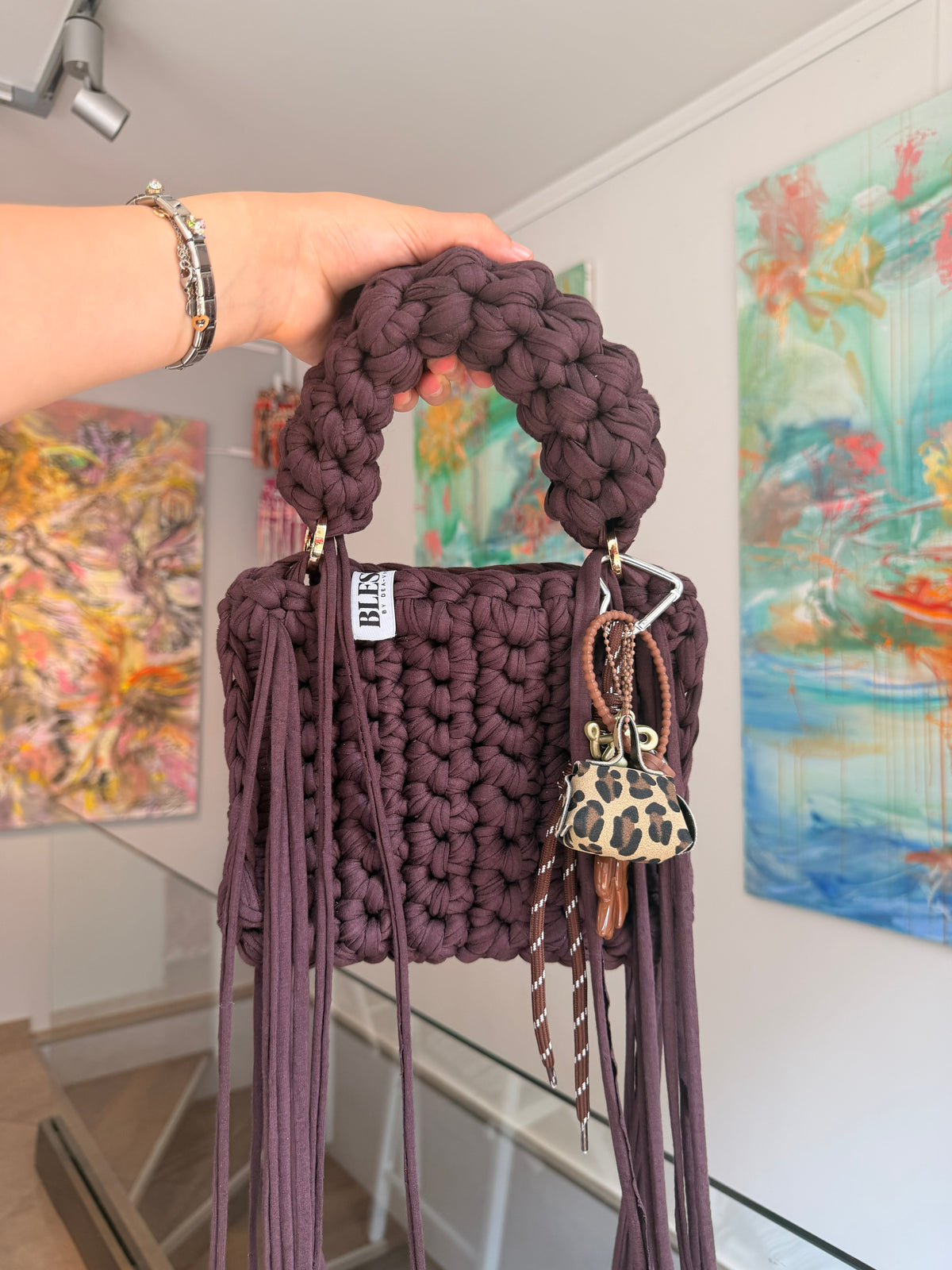 Brown crochet bag showing gold ring handle detail