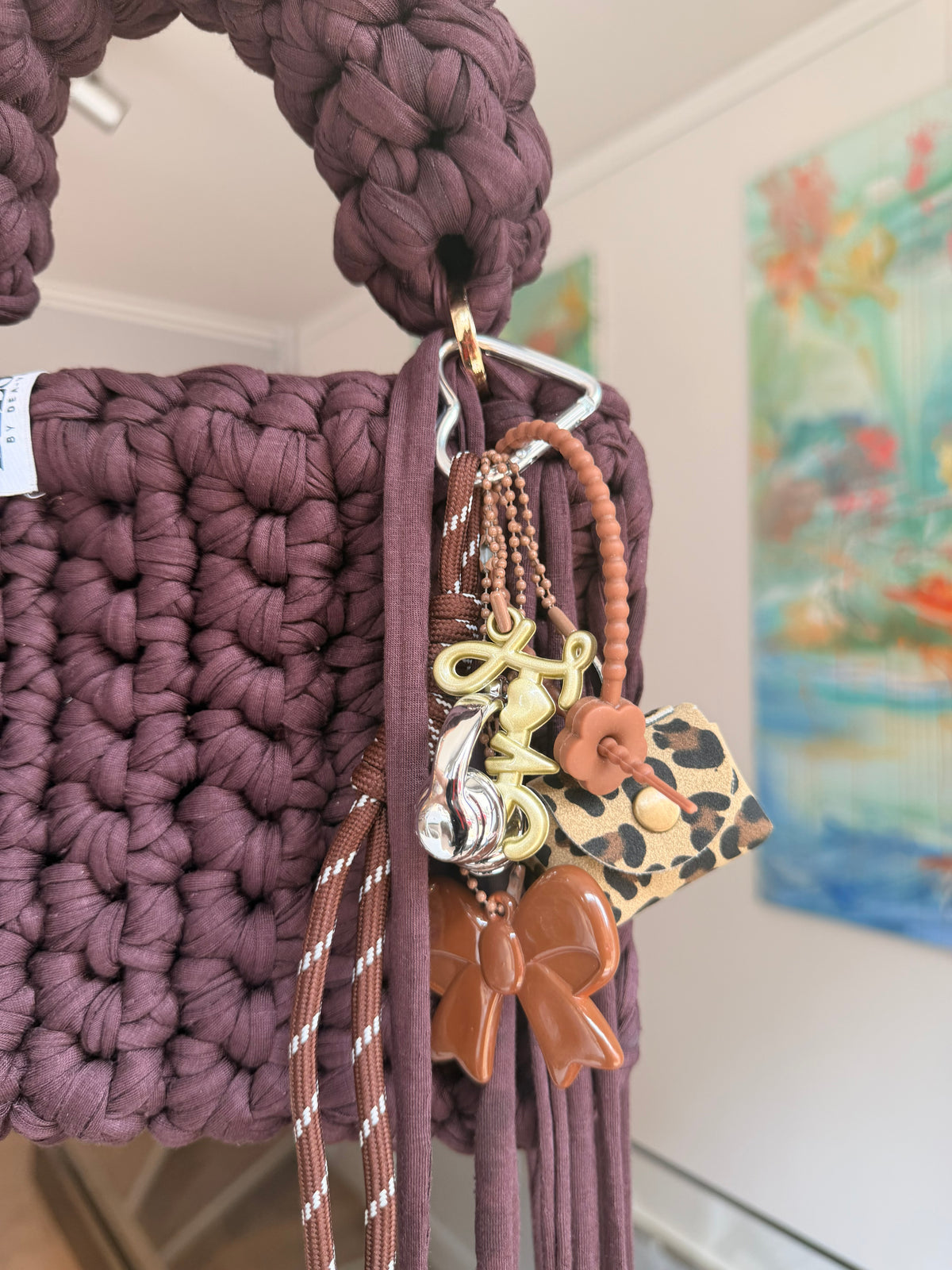 Close-up of brown crochet texture and woven Blessed label