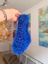 Close-up of blue tube yarn and feathered yarn crochet texture