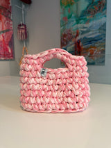 Soft pink crochet bag with a silver thread and a chunky braided top handle
