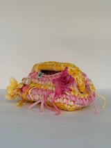 Blessed by DV crochet clutch with a plaited marigold and cream top handle
