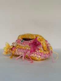 Blessed by DV crochet clutch with a plaited marigold and cream top handle