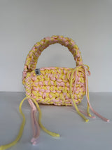 Lemon and pink crochet bag with a big rounded handle, gold heart clasp and long ties