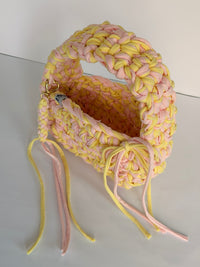 Lemon and pink crochet bag with a big rounded handle, gold heart clasp and long ties
